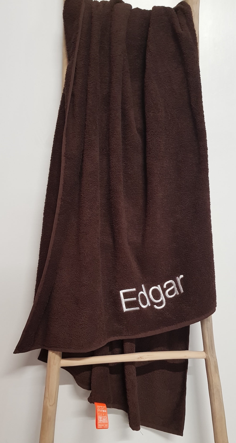 Bruin strandlaken borduren