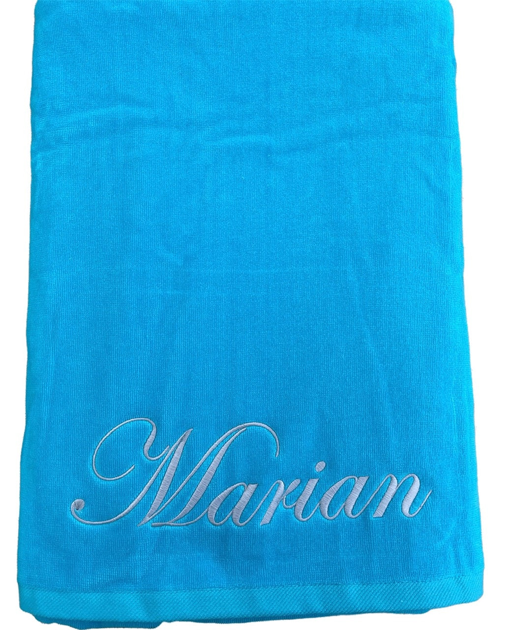 velours strandlaken turquoise met borduring